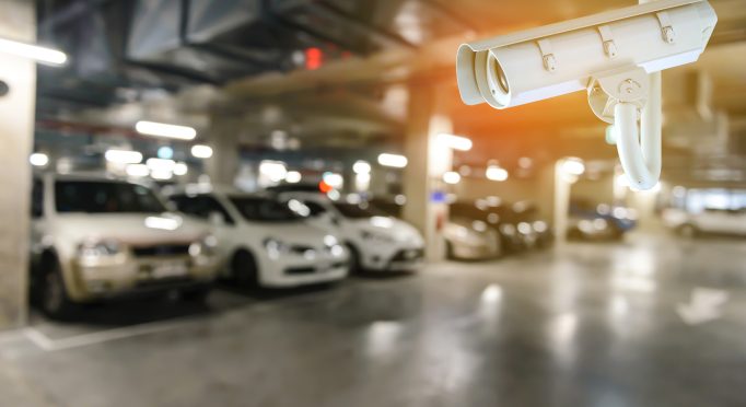 CCTV Security camera with blurred image of underground cars parking with cars.